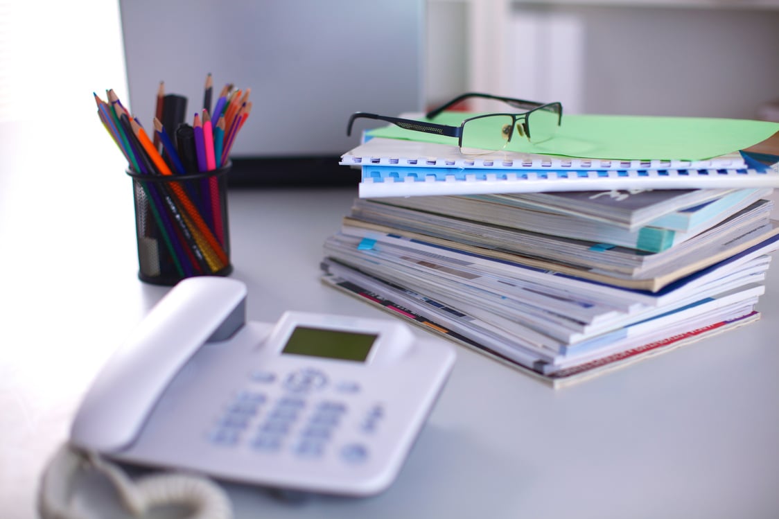 Group of multicolored office folders and glasses